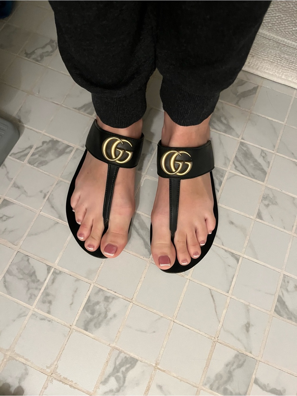 Authentic Used Gucci Black Leather GG Thong Sandals with Gold Hardware